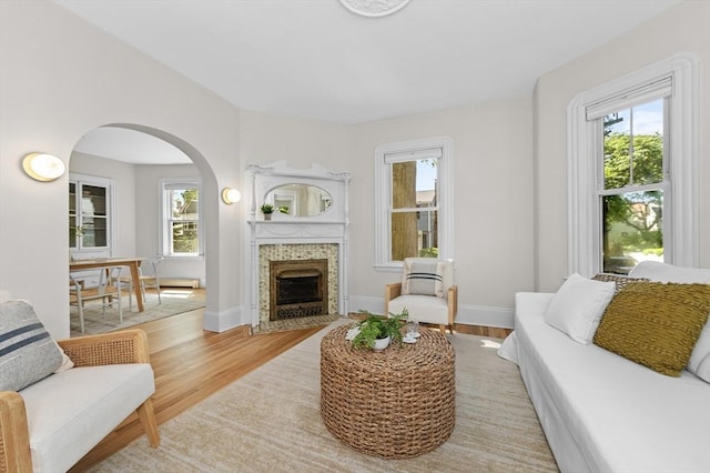 85 Holworthy Unit 85, Cambridge, MA 02138 - living area featuring arched walkways, light wood-type flooring, and plenty of natural light