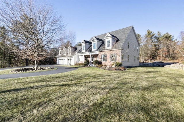 view of front facade with a front lawn and a garage