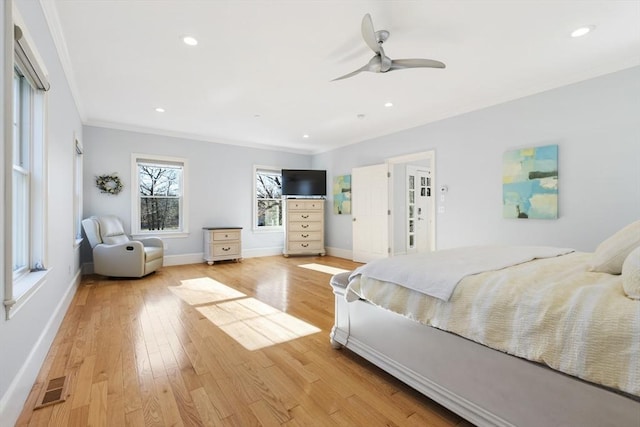 bedroom with ceiling fan, light hardwood / wood-style flooring, and crown molding