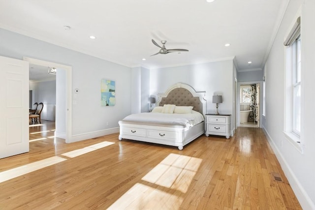 bedroom featuring ceiling fan, light wood-type flooring, and crown molding