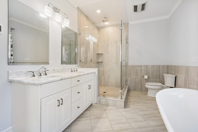 bathroom featuring tile patterned floors, an enclosed shower, toilet, vanity, and ornamental molding