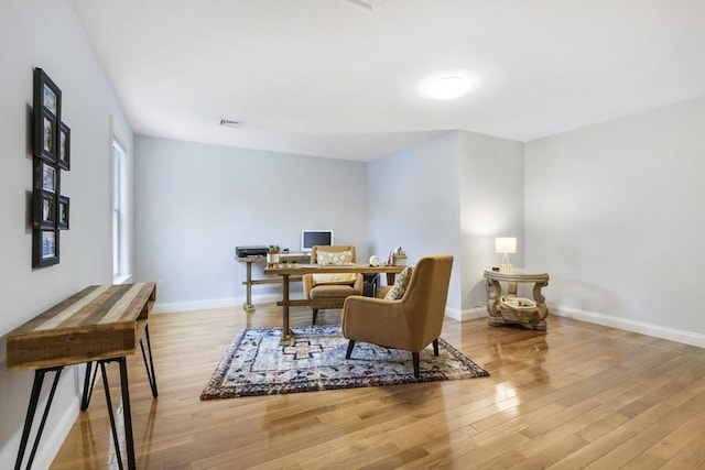 office with hardwood / wood-style flooring