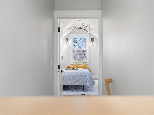 bedroom featuring a notable chandelier