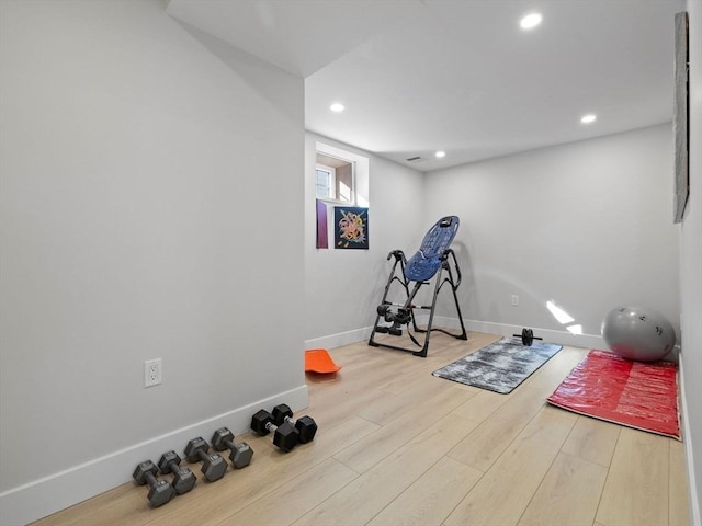 workout area featuring light hardwood / wood-style flooring