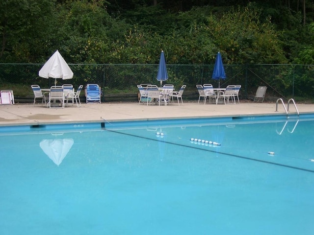 2 Summit Dr Unit 18, Reading, MA 01867 - community pool featuring outdoor dining area and a patio area