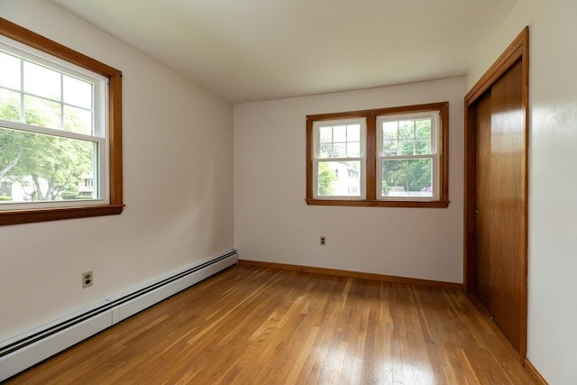 4 Morningside Dr, Beverly, MA 01915 - unfurnished room featuring baseboard heating, healthy amount of natural light, light wood-style floors, and baseboards