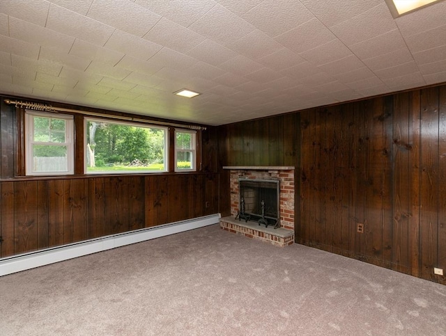 4 Morningside Dr, Beverly, MA 01915 - unfurnished living room with a baseboard heating unit, carpet floors, wood walls, and a fireplace