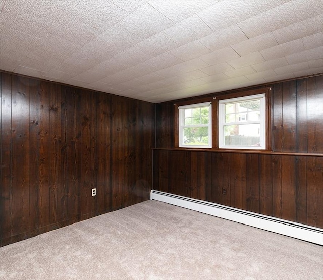 4 Morningside Dr, Beverly, MA 01915 - carpeted empty room with baseboard heating and wood walls