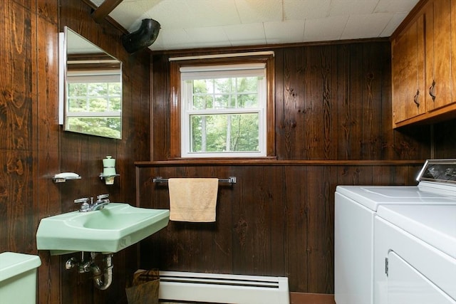 4 Morningside Dr, Beverly, MA 01915 - laundry area featuring a baseboard radiator, independent washer and dryer, wooden walls, healthy amount of natural light, and cabinet space