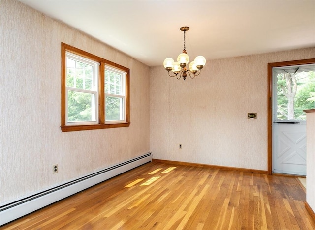 4 Morningside Dr, Beverly, MA 01915 - empty room featuring a baseboard heating unit, light wood-style floors, a chandelier, and plenty of natural light