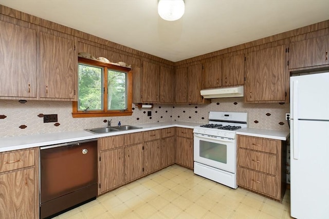 4 Morningside Dr, Beverly, MA 01915 - kitchen featuring white appliances, under cabinet range hood, a sink, light flooring, and backsplash
