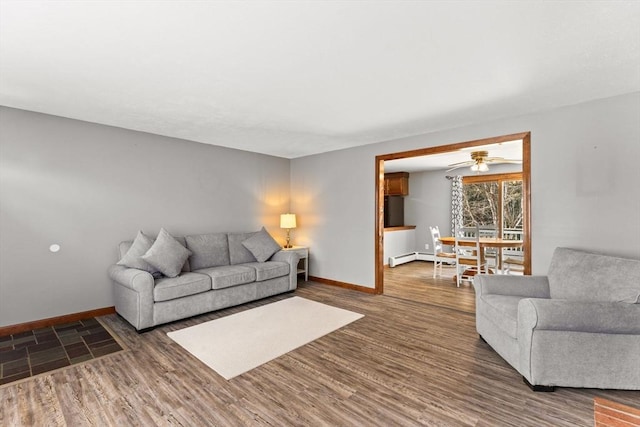 living room featuring wood finished floors and baseboards