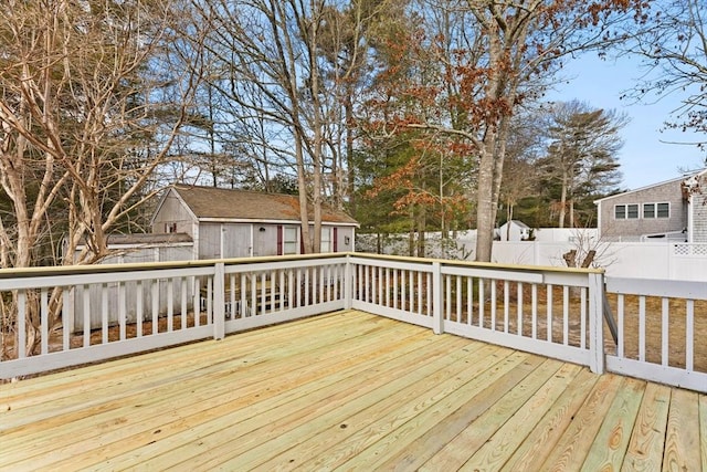 wooden terrace with fence private yard and an outdoor structure