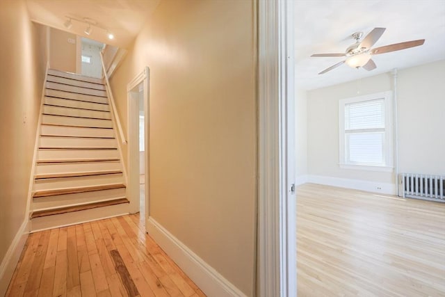 20-22 Ashland Ave, Methuen, MA 01844 - staircase featuring wood finished floors, radiator, baseboards, and ceiling fan