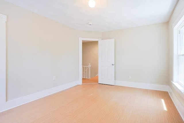 20-22 Ashland Ave, Methuen, MA 01844 - empty room featuring light wood finished floors, baseboards, and a smoke detector