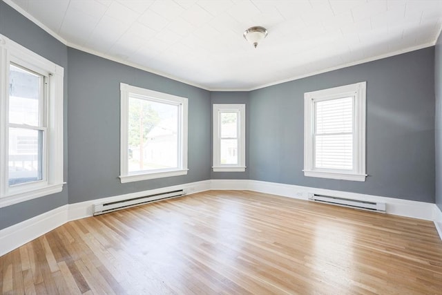 20-22 Ashland Ave, Methuen, MA 01844 - empty room featuring ornamental molding, a baseboard heating unit, wood finished floors, and baseboards