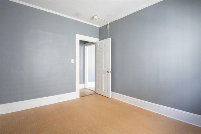 20-22 Ashland Ave, Methuen, MA 01844 - unfurnished room with ornamental molding, baseboards, and light wood-style floors