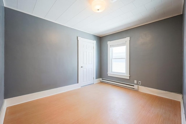 20-22 Ashland Ave, Methuen, MA 01844 - spare room featuring baseboard heating, wood finished floors, and baseboards