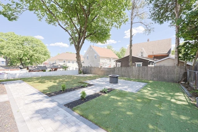20-22 Ashland Ave, Methuen, MA 01844 - view of yard featuring a patio, an outdoor fire pit, and a residential view