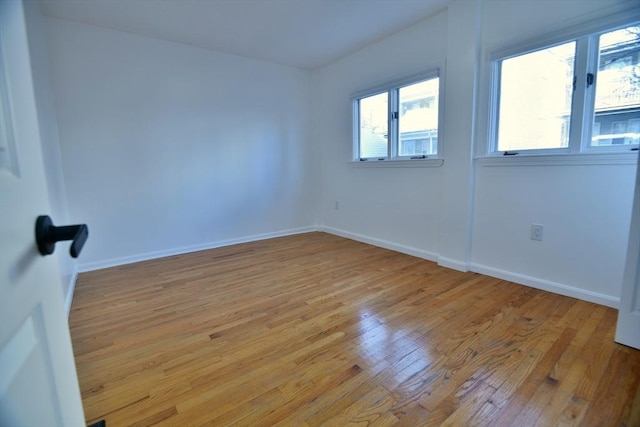 spare room featuring light wood-type flooring