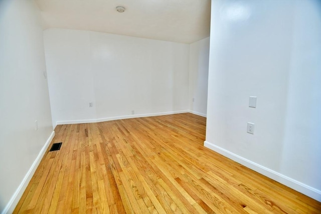 unfurnished room with light hardwood / wood-style flooring