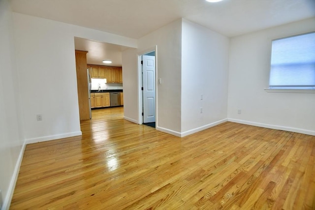 unfurnished living room featuring light wood-type flooring