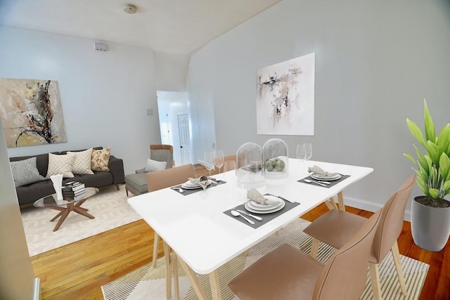 dining area with hardwood / wood-style flooring