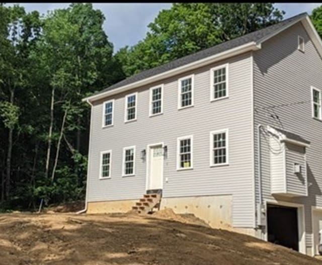 colonial inspired home with a garage