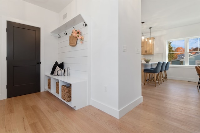 mudroom with light hardwood / wood-style flooring