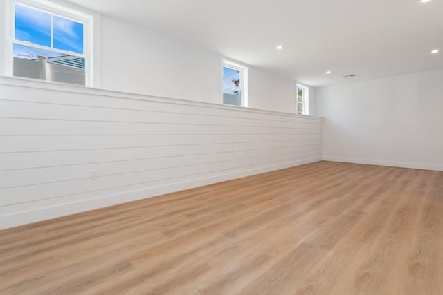 basement featuring light hardwood / wood-style floors