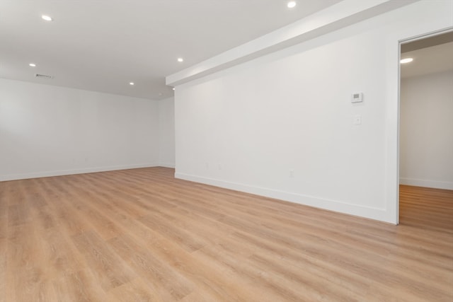 spare room with light hardwood / wood-style floors