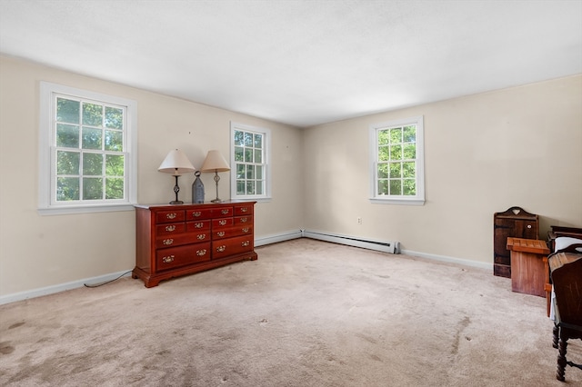 living area with a baseboard radiator and carpet flooring