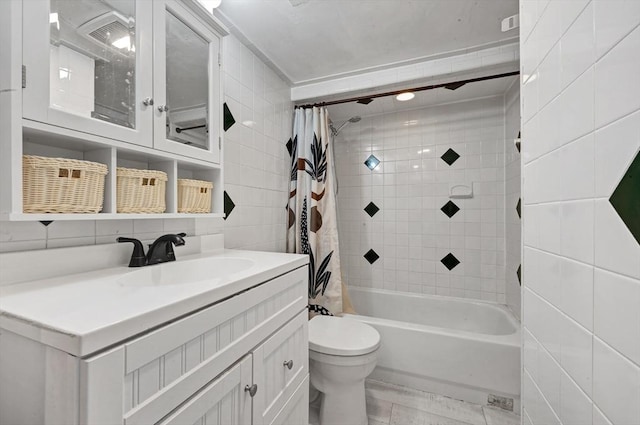 full bathroom with tile walls, toilet, shower / bath combo, and vanity