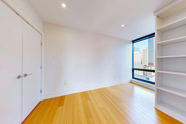 45 Province St Unit U1602, Boston, MA 02108 - unfurnished bedroom featuring light wood-type flooring, recessed lighting, and baseboards