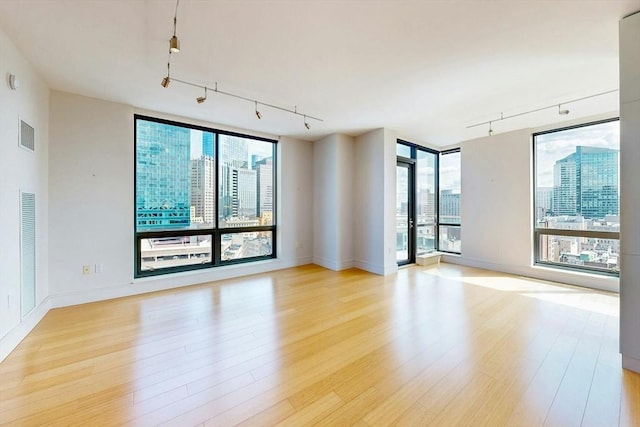 45 Province St Unit U1602, Boston, MA 02108 - unfurnished room featuring track lighting, healthy amount of natural light, and light wood-style flooring