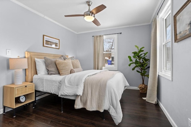 bedroom featuring ornamental molding, dark wood finished floors, a ceiling fan, and baseboards