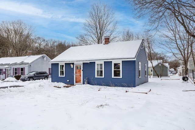 view of front of home with a chimney