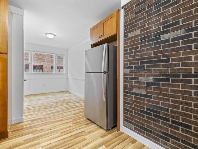 9-11 Edmunds St, Cambridge, MA 02140 - kitchen with freestanding refrigerator, light wood-type flooring, baseboards, and brown cabinetry