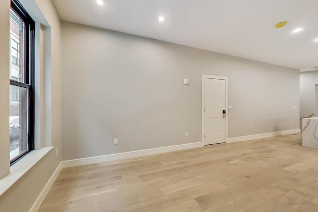 unfurnished room featuring light hardwood / wood-style flooring