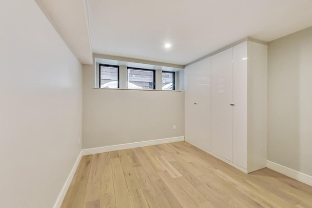 spare room with light wood-type flooring