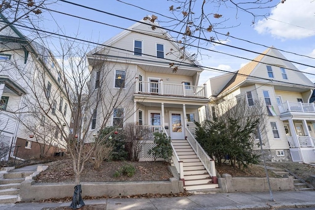 view of front of home featuring a balcony and a porch