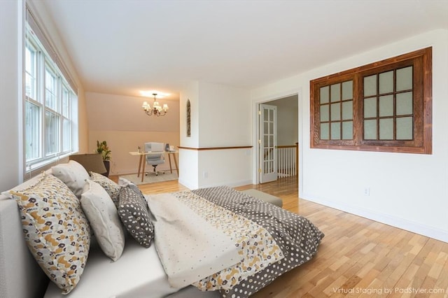 14 Chandler Ln, Amherst, NH 03031 - bedroom featuring a chandelier and wood finished floors