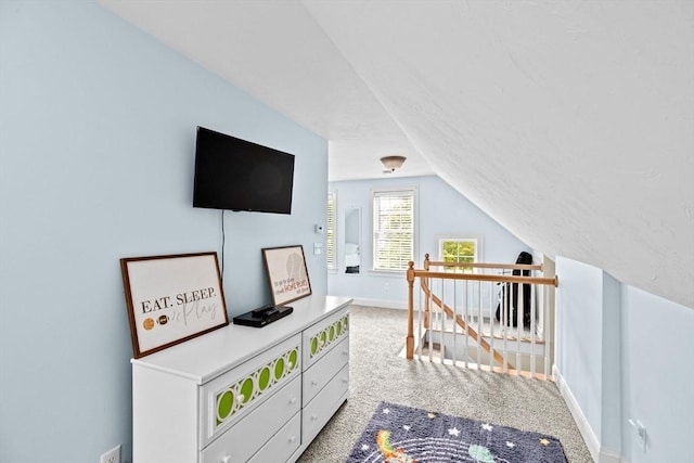game room with carpet, lofted ceiling, and baseboards