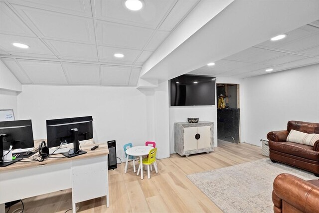 living room featuring recessed lighting, light wood finished floors, and an office area