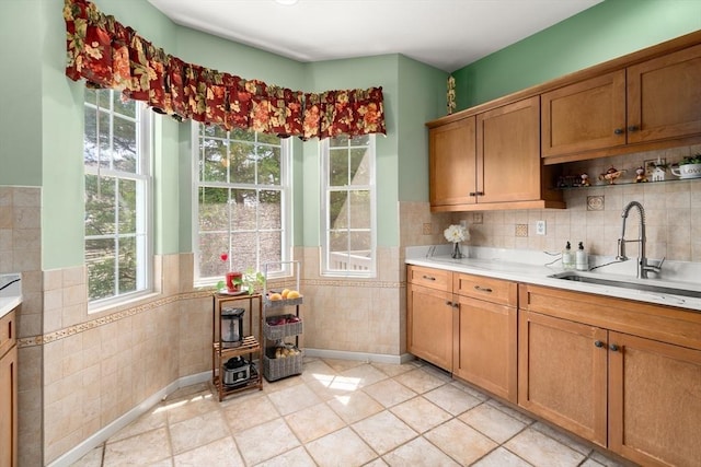 41 Edward Dr Unit 41, Grafton, MA 01536 - kitchen featuring tile walls, light countertops, a wainscoted wall, brown cabinets, and a wood stove