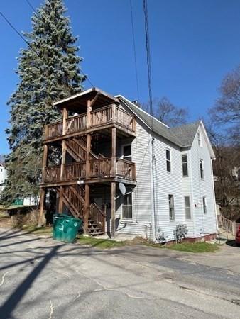 376 Elm St, Fitchburg, MA 01420 - view of front facade with stairway and a wooden deck