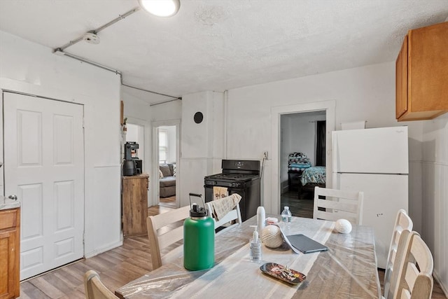 376 Elm St, Fitchburg, MA 01420 - dining space with light wood-style flooring
