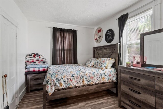376 Elm St, Fitchburg, MA 01420 - bedroom featuring wood finished floors and a textured ceiling