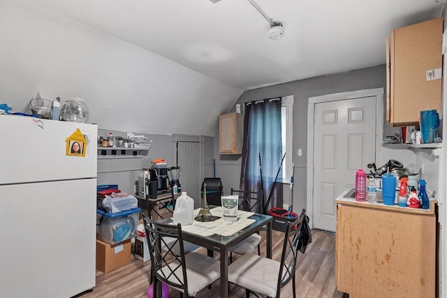 376 Elm St, Fitchburg, MA 01420 - dining space featuring light wood-style flooring and lofted ceiling