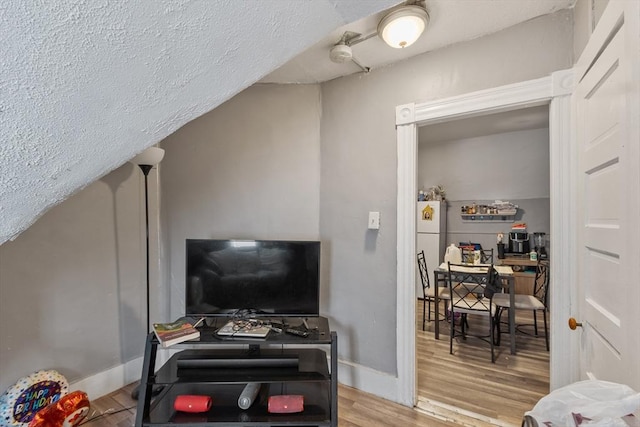 376 Elm St, Fitchburg, MA 01420 - living room featuring wood finished floors and a textured ceiling
